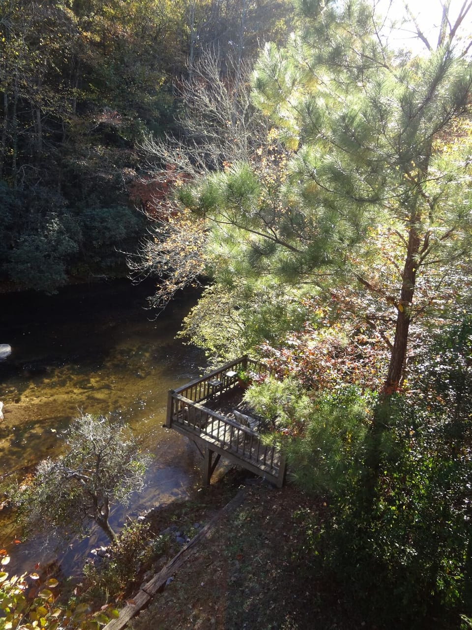 Autumn view of riverside deck from master bedroom balcony.