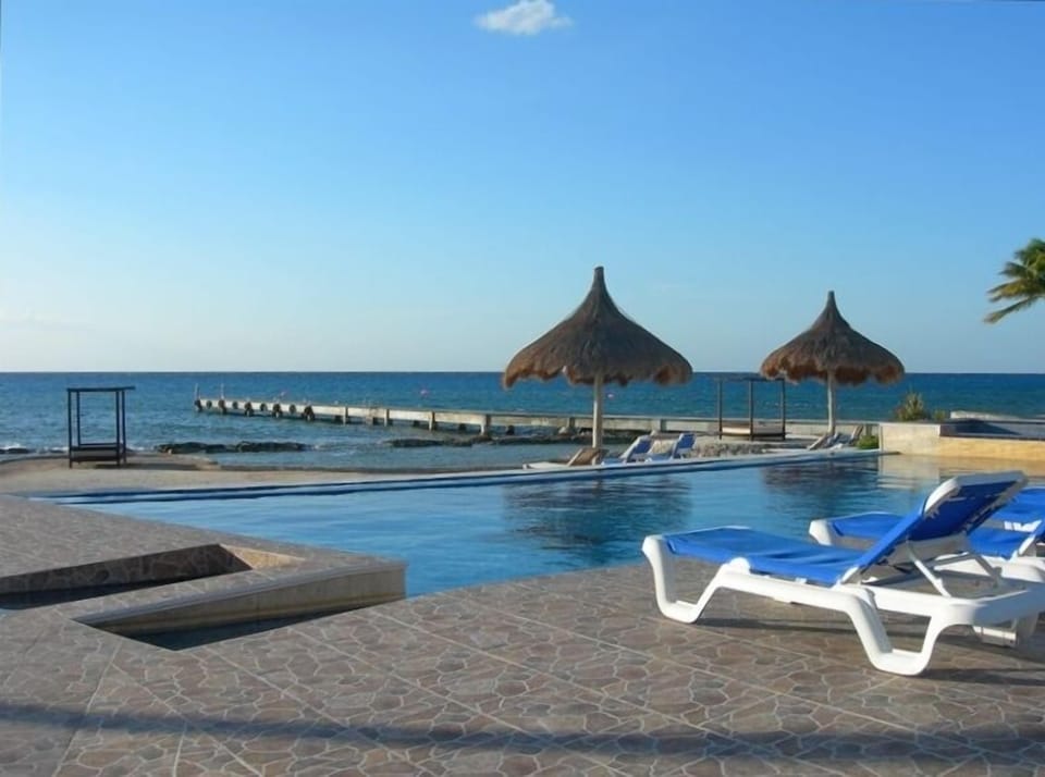 Infinity pool, beach, and private dock for boat pick-up
