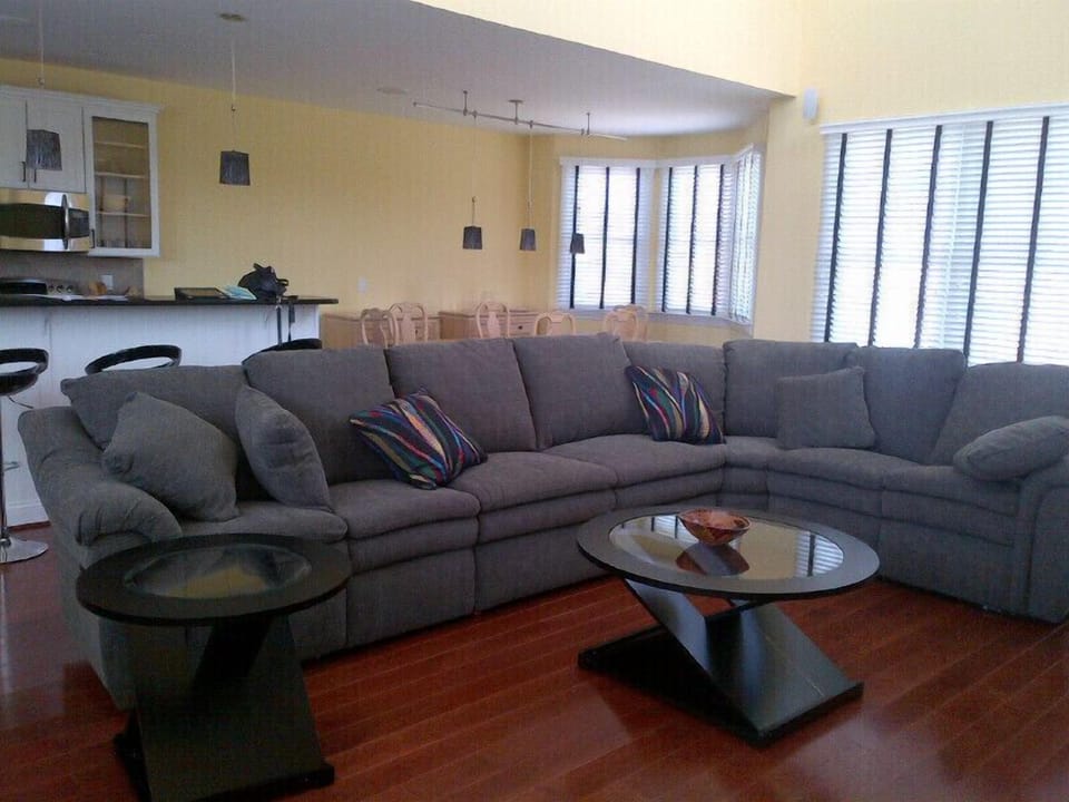 Sofa in the great room, next to the kitchen and dining area.