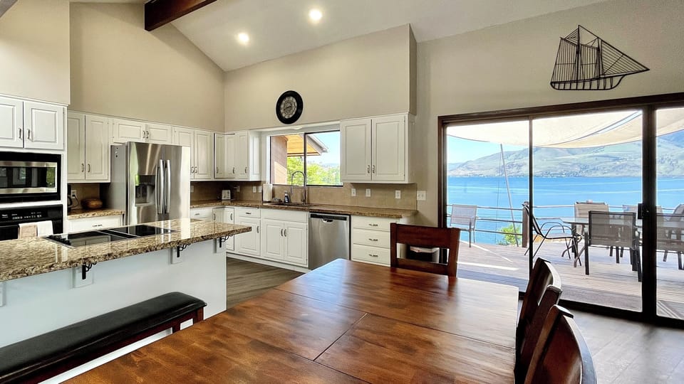 Large open spaces with plenty of room in the kitchen and dining room; dining room table has multiple benches