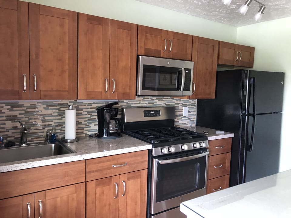 Updated kitchen with new appliances, cabinets and granite countertop