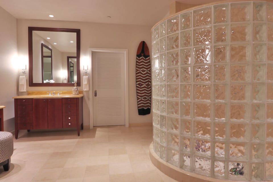 Second vanity in master bath . Large glass-block enclosed shower area