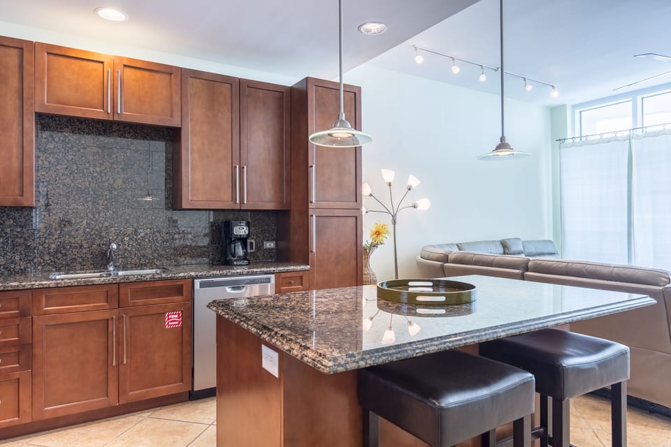 Amazing kitchen fully stocked with cooking utensils and stainless steel appliances!
