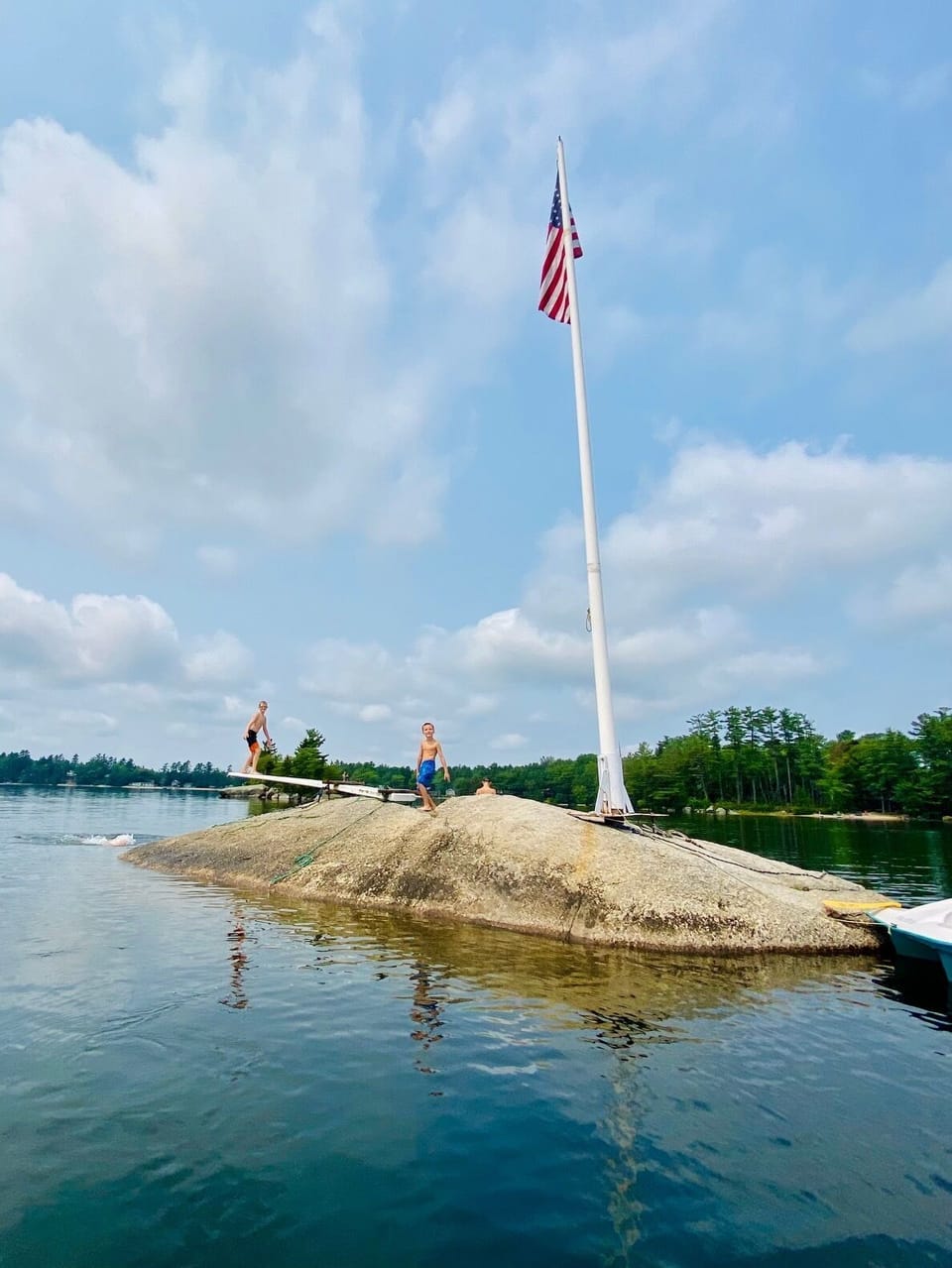 The diving rock in the center of the lake is a family favorite