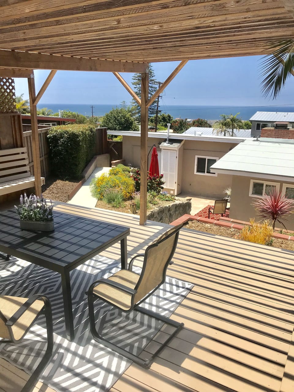 Beautiful ocean views from covered deck.
Backyard is on a hill with some steps.