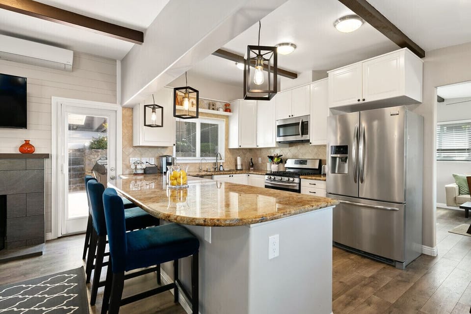 Kitchen open to LR. Fully stocked kitchen.