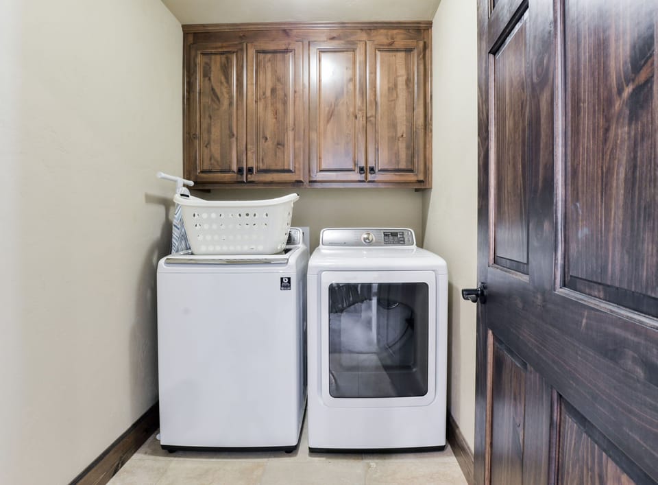 Two full-sized laundry rooms with detergent