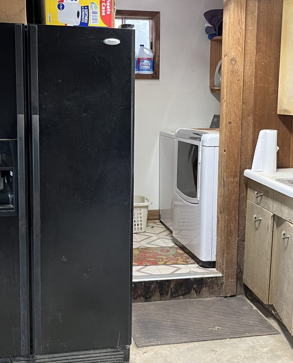Extra frig/freezer in garage along with washer and dryer