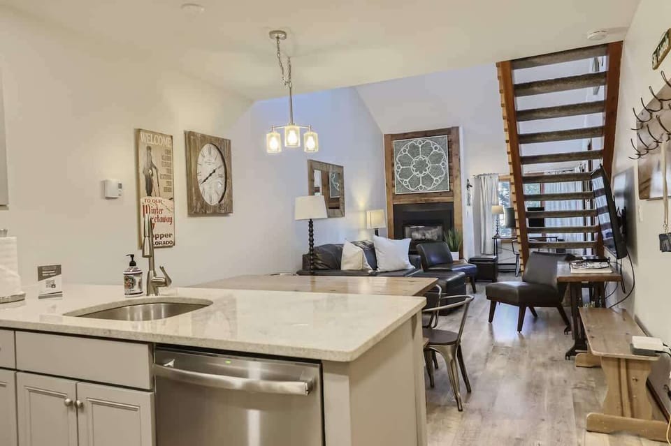 Modern Kitchen & Dining: Prepare meals in our fully equipped, modern kitchen featuring stainless steel appliances and dine in style at the spacious dining table, perfect for family meals or a cozy dinner for two.