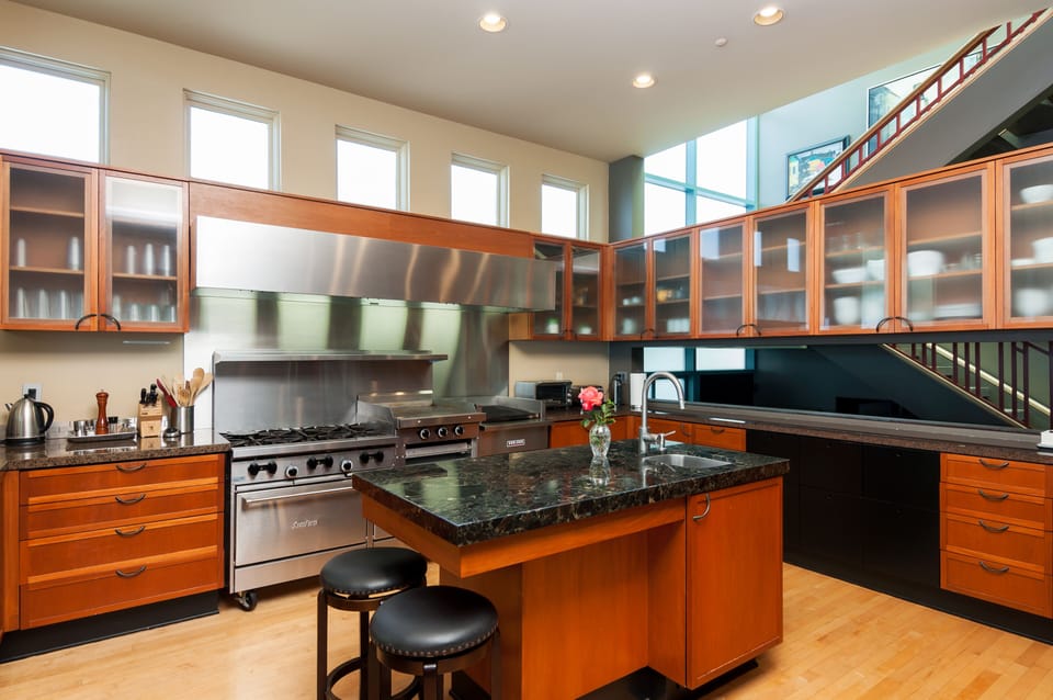 Well stocked Chefs  Kitchen with Commercial Range, Flat Griddle & Grill.