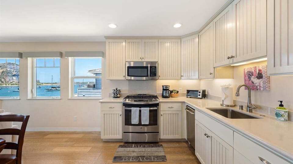 The kitchen has high-end appliances and everything you need to cook a nice meal.