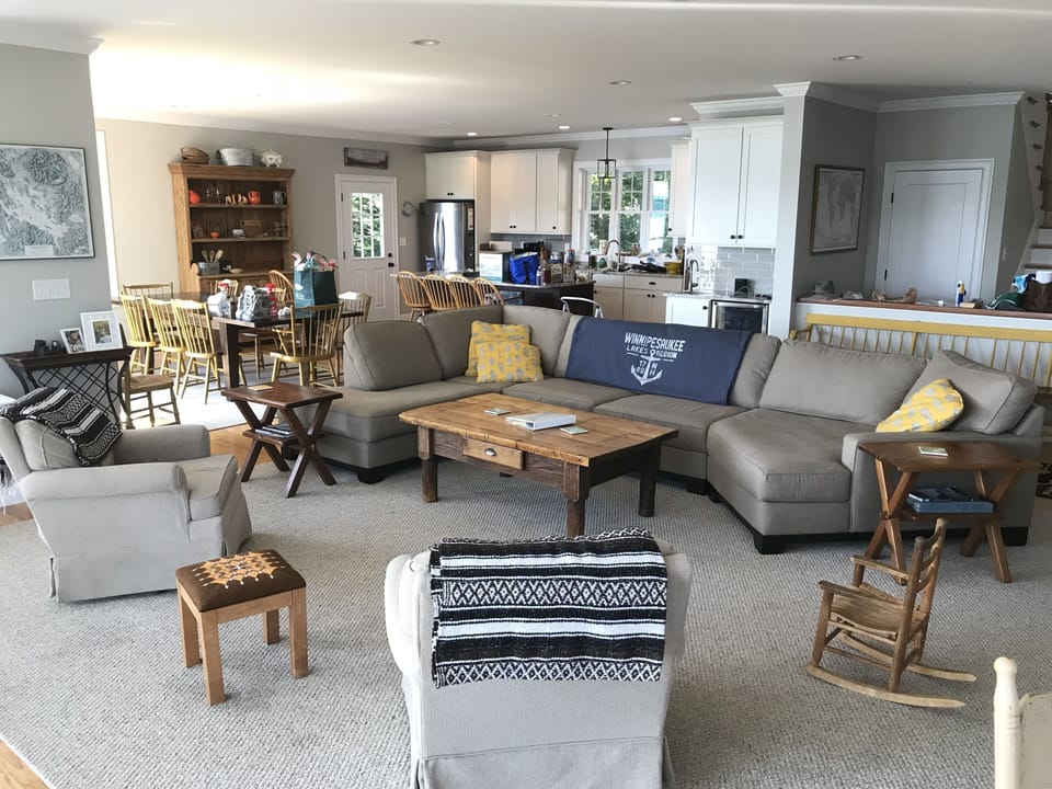 Open concept first floor with kitchen, dining, and living area