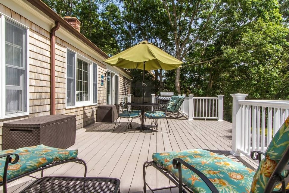 Onto a killer deck with 3 seating areas and a grill.