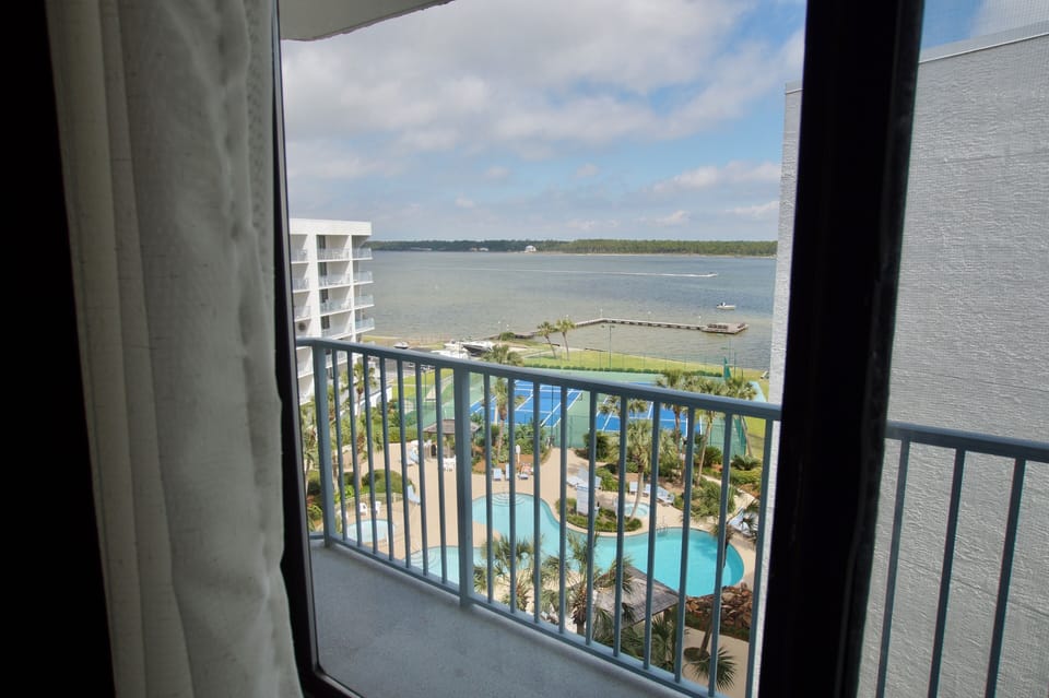 Looking through the bedroom window over our pool and out to the Little Lagoon.

