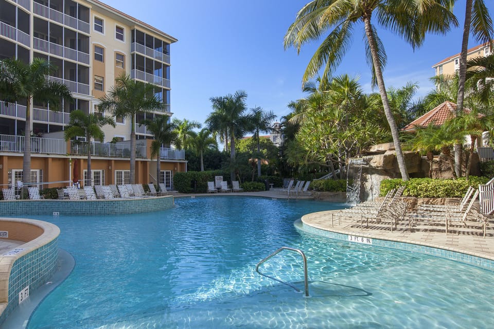 Zero entry resort style pool with hot tub and waterfall at your doorstep.