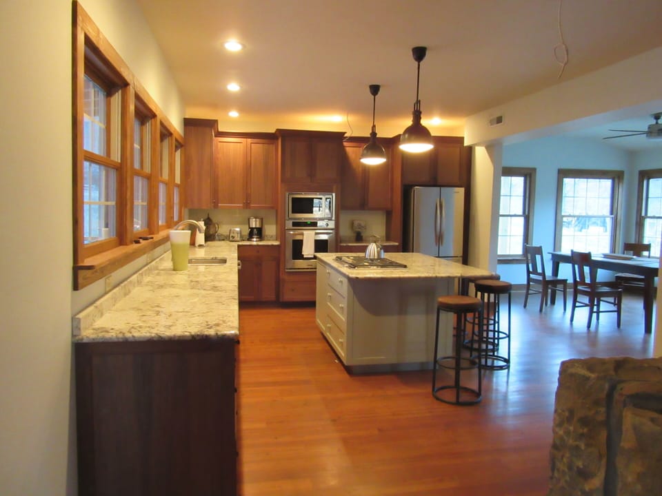 Large open kitchen, beautiful hardwood floors and granite counter tops