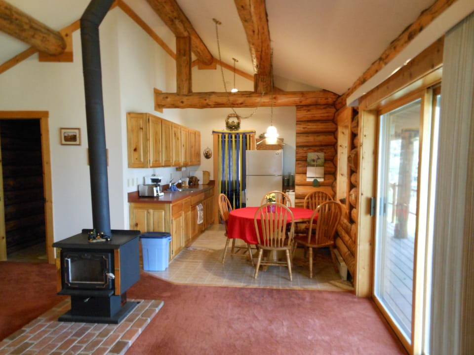 Kitchen area off the living room...walk out the sliding door for lake views !