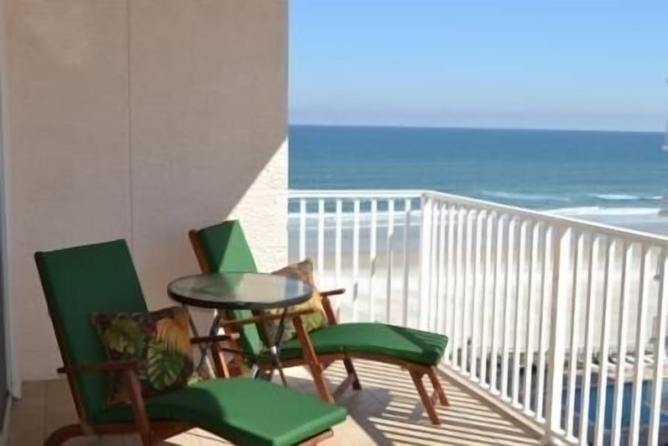 2 lounge chairs & 4 chairs w/ table on balcony