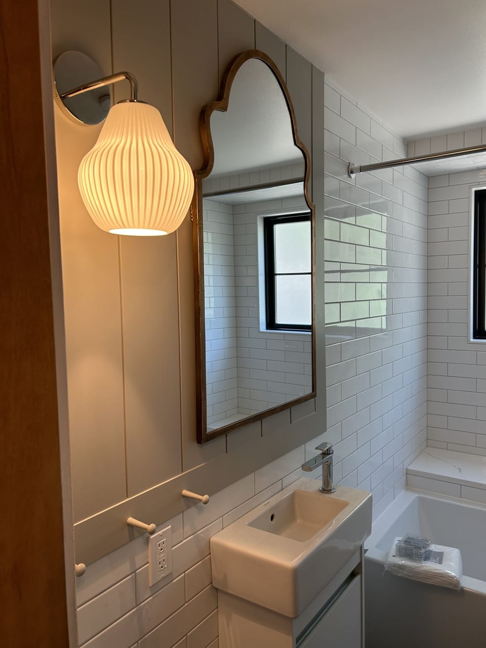 Adorable full bath with wall planking 