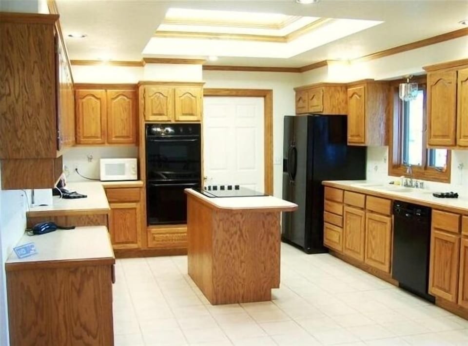 Kitchen with double oven. Extra refrigerator also in laundry room.