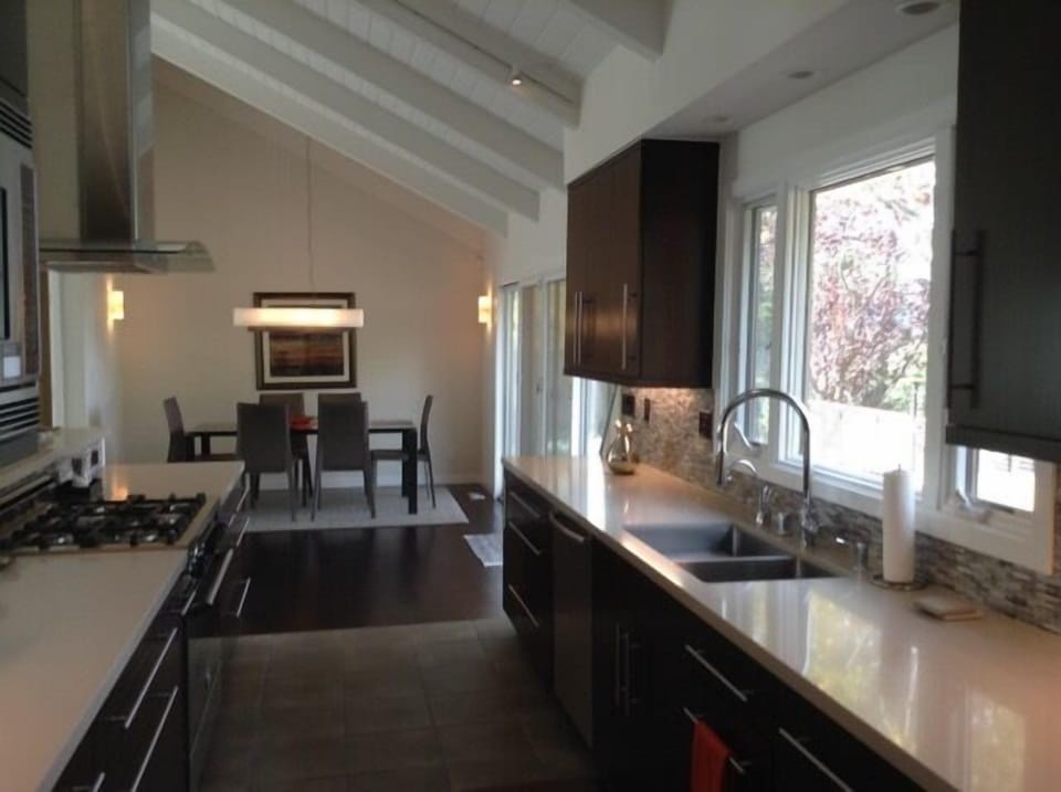 Chef's kitchen has plenty of counter space, top appliances, and tons of storage