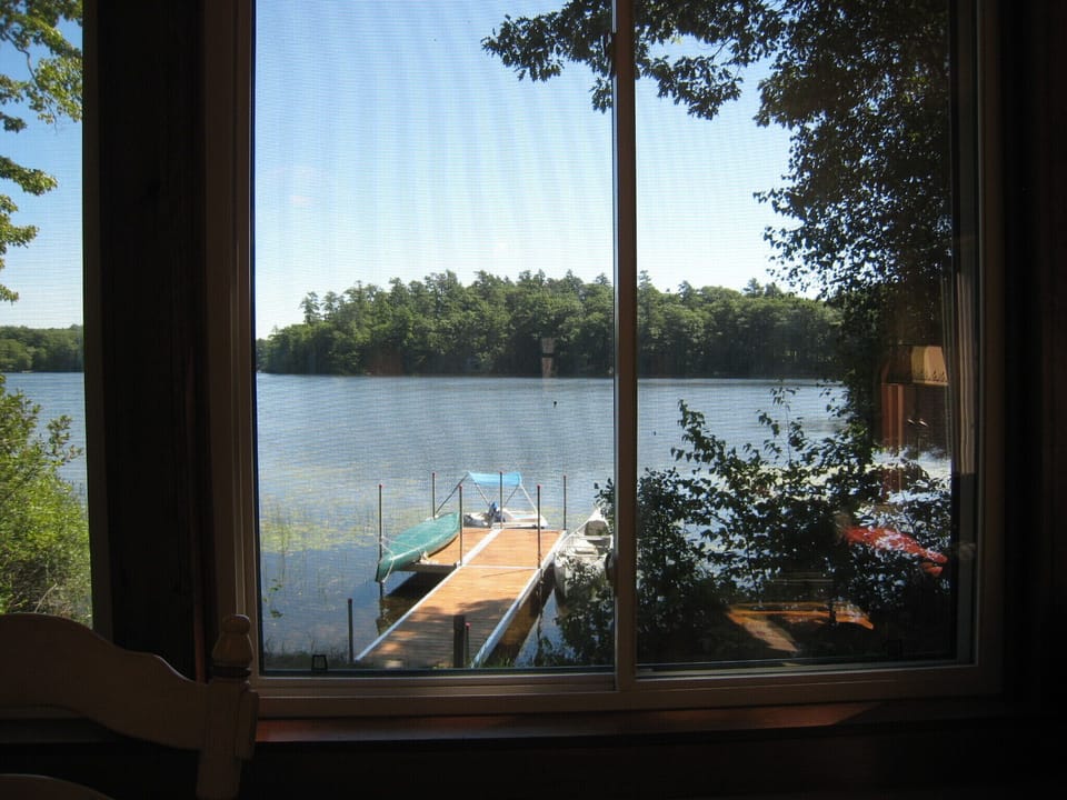 Waterview from dining/sunroom to new dock. Canoe, kayak and paddleboat 20' away