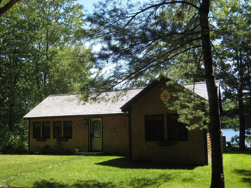 Golden Meadow Cottage - nicely landscaped w/ manicured lawn & pretty flower beds