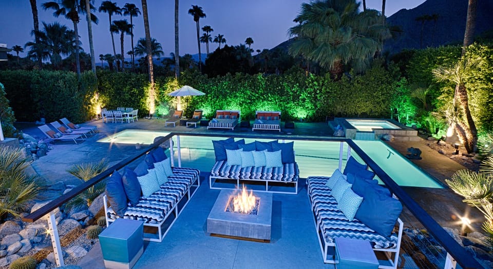 Fire pit overlooking lap pool at night