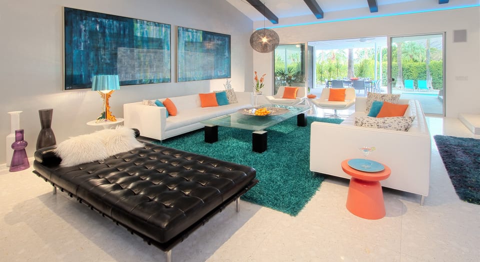 Huge living room overlooking outdoor dining and pool area. 