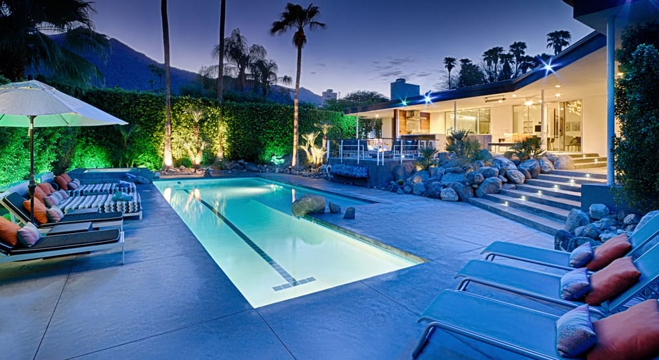 Lap pool & lounge area at dusk