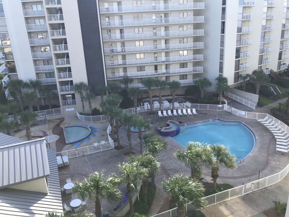 Pool with kiddie pool area and hot tub.
