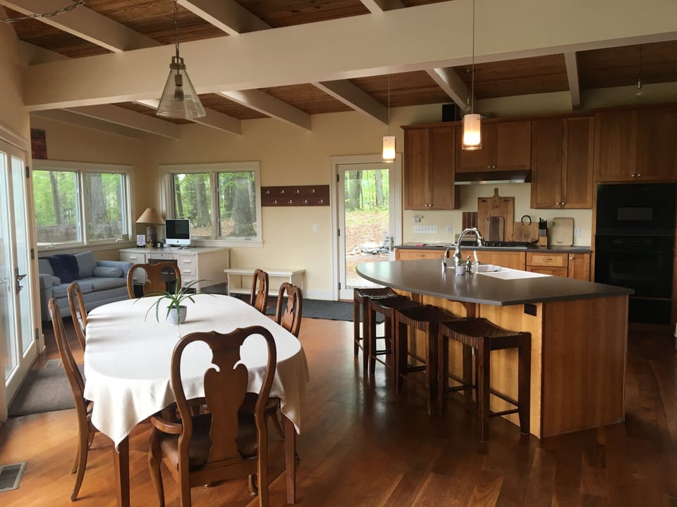 Kitchen, table seats up to 10, counter seating for 4, view of woods