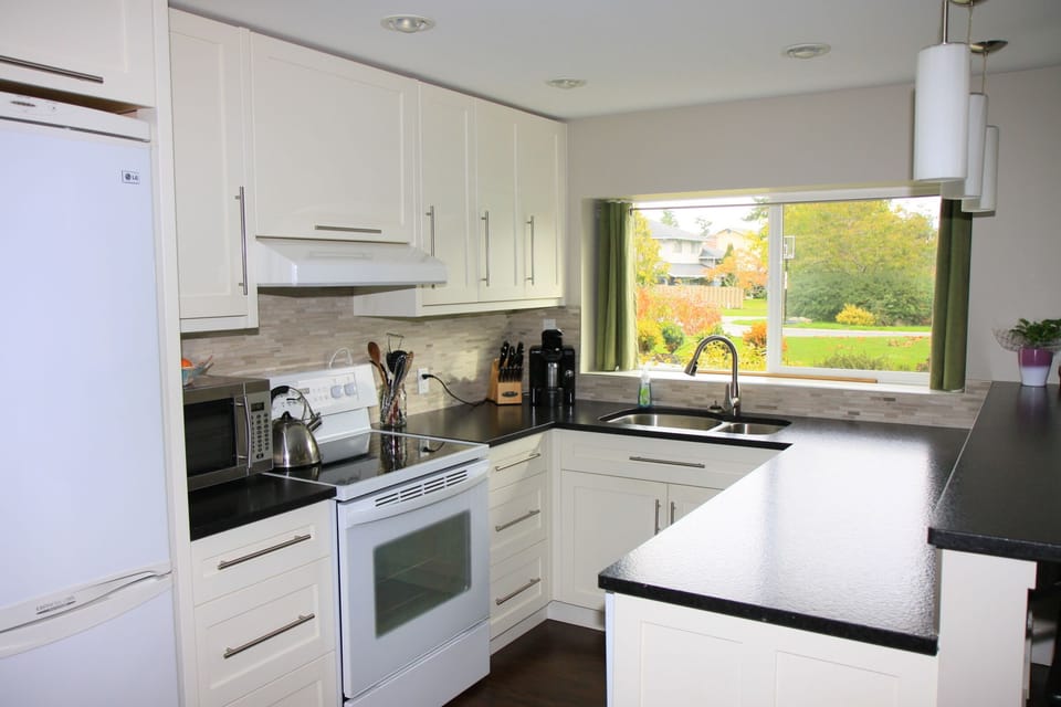 Full size stove, sink & dishwasher, apartment size fridge.  Granite countertops.