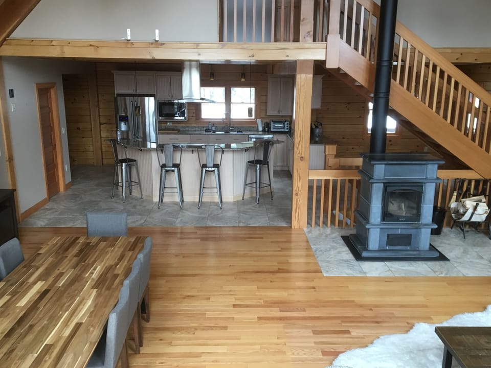 Open floor plan. Dining room and Eat in kitchen with four bar,  stools