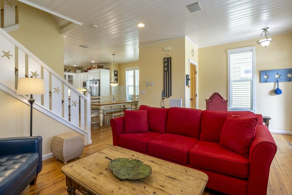 Experience classic beach cottage style — wood floors, white-painted wainscoting, and décor that complements the coastal vibe.