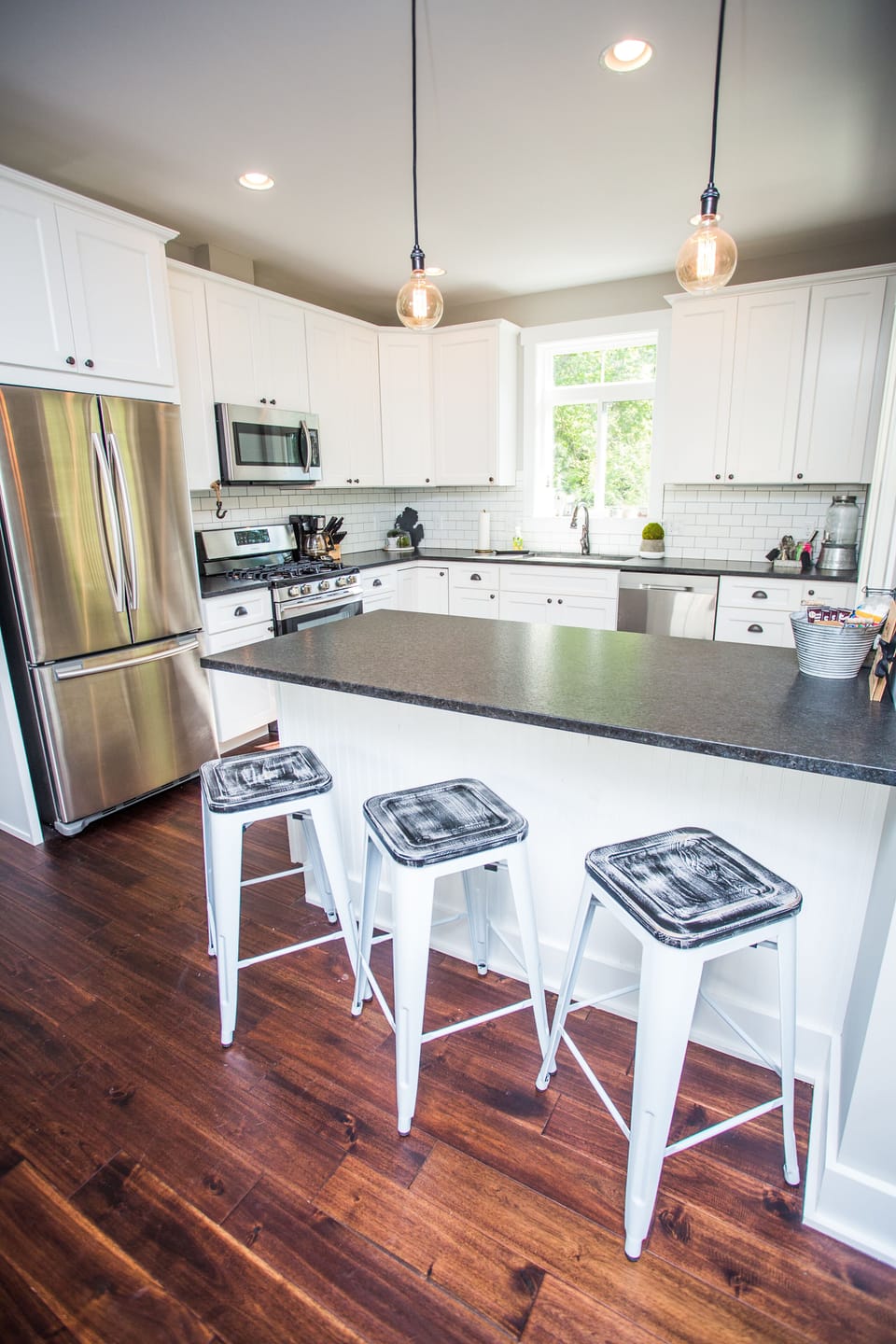 Beautiful, fully stocked gourmet kitchen with additional seating at the island. 
