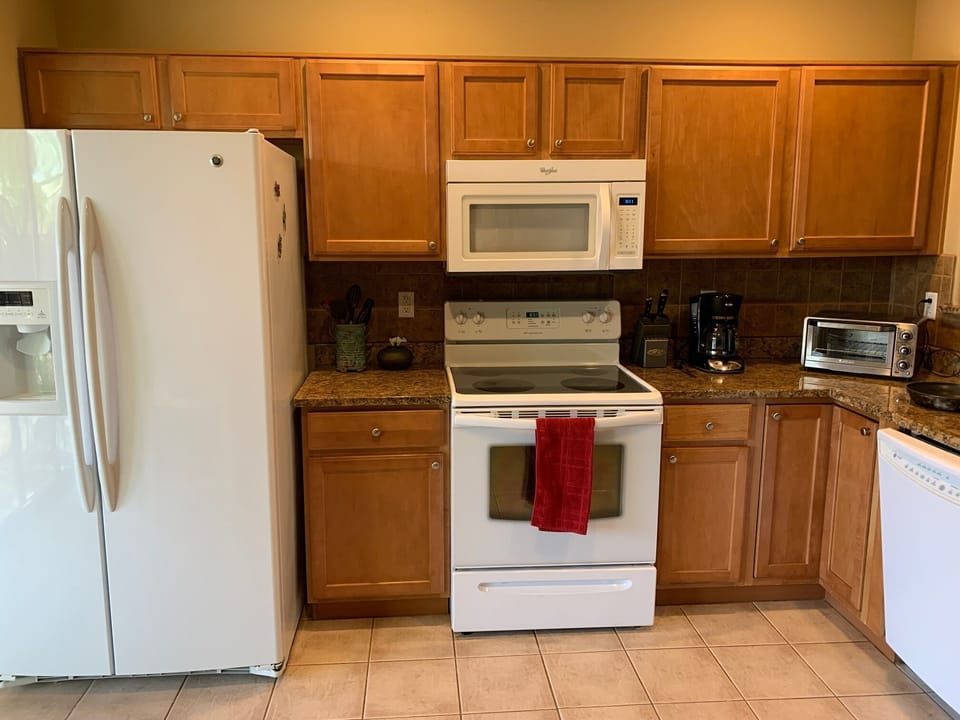 The kitchen is spacious and well equipped with all utensils.