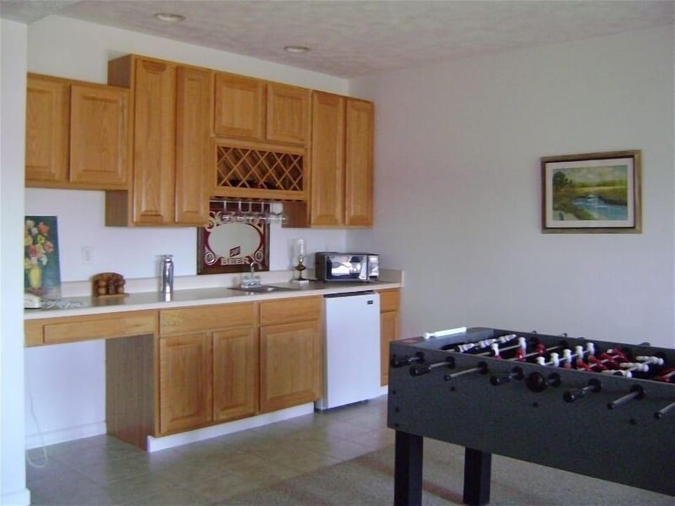 Wet bar and foosball game in den