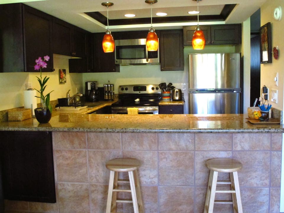 View From Dining Area - Kitchen With Extra Large Counter and Barstools
