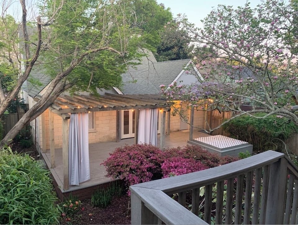 Porch view Cottage to the House. Privacy drapes are in each space