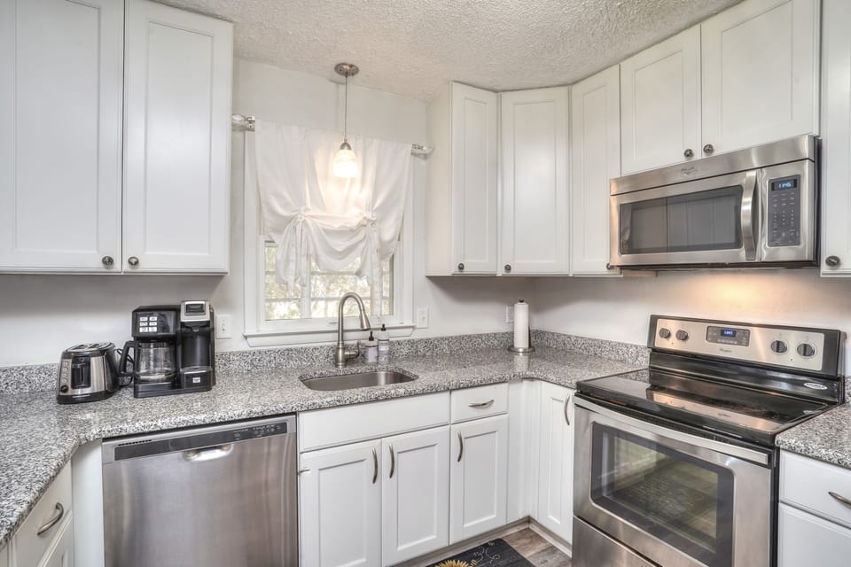 modern kitchen with garbage disposal, coffe maker, toaster etc,