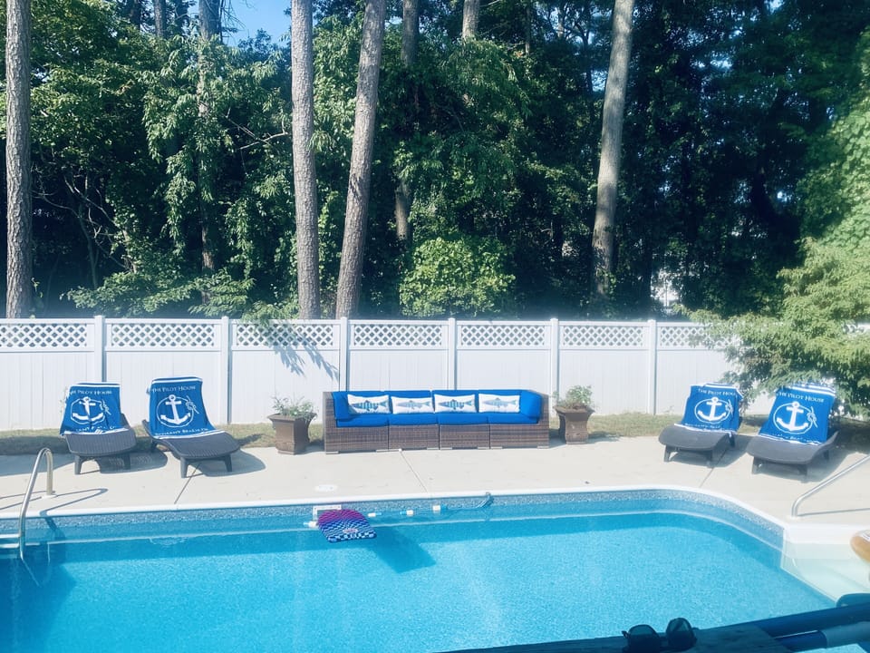 Large in-ground pool & grill for cooking.  Cushioned lounge sofa and recliners
