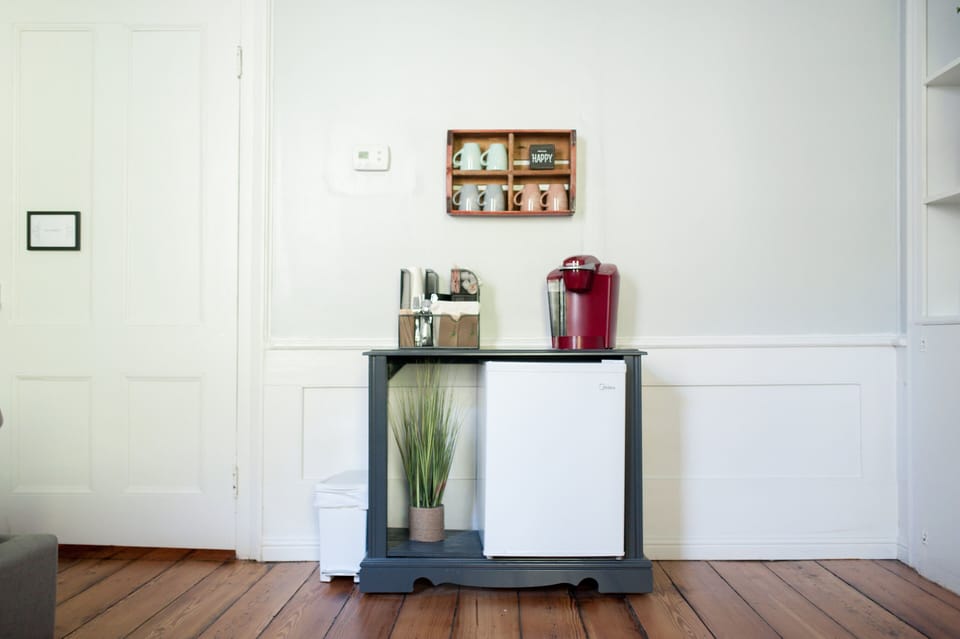 Kitchenette includes a mini fridge, Keurig brewer and toaster. 
