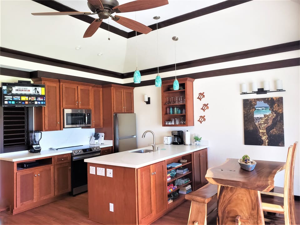 New kitchen with custom cabinets, quartz counters & stainless steel appliances.
