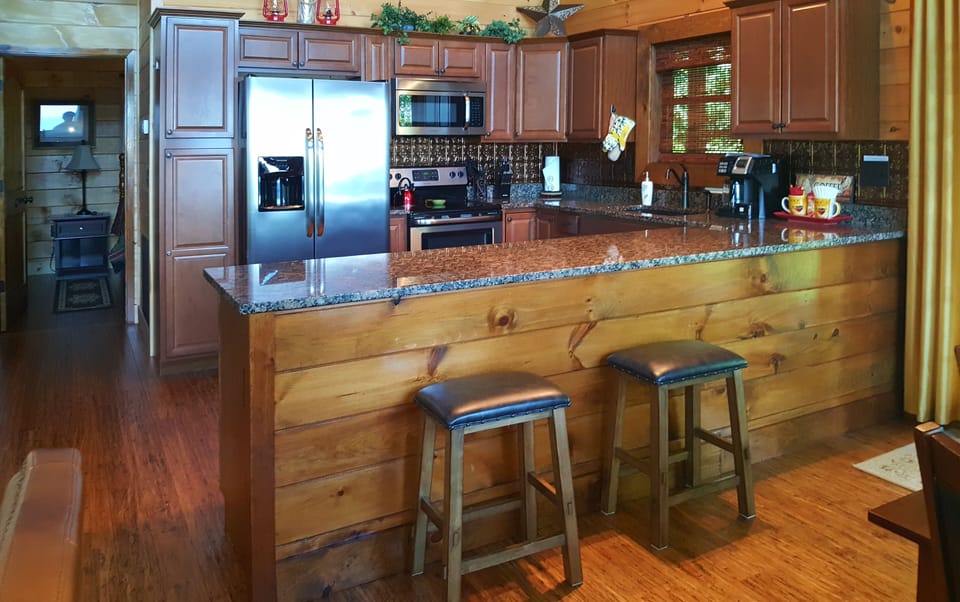 Kitchen with bar stool counter
