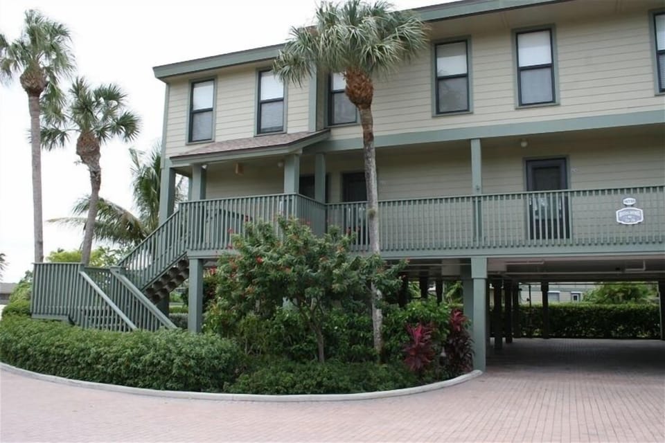 Corner unit #N74 overlooking the pool with boat slip #L and covered parking