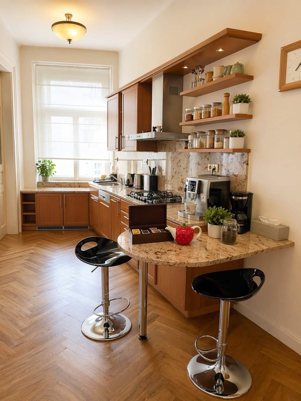 Fully equipped kitchen with espresso machine and breakfast bar.