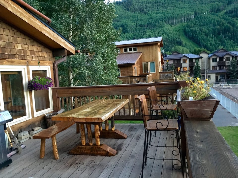Great deck. Perfect for dining outside. Sunset and ski hill views. Gas BBQ.