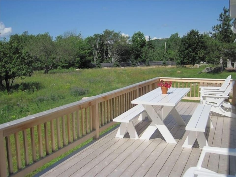 relax on the deck while taking in views of Cadillac Dorr Gorham & Champlain Mnts