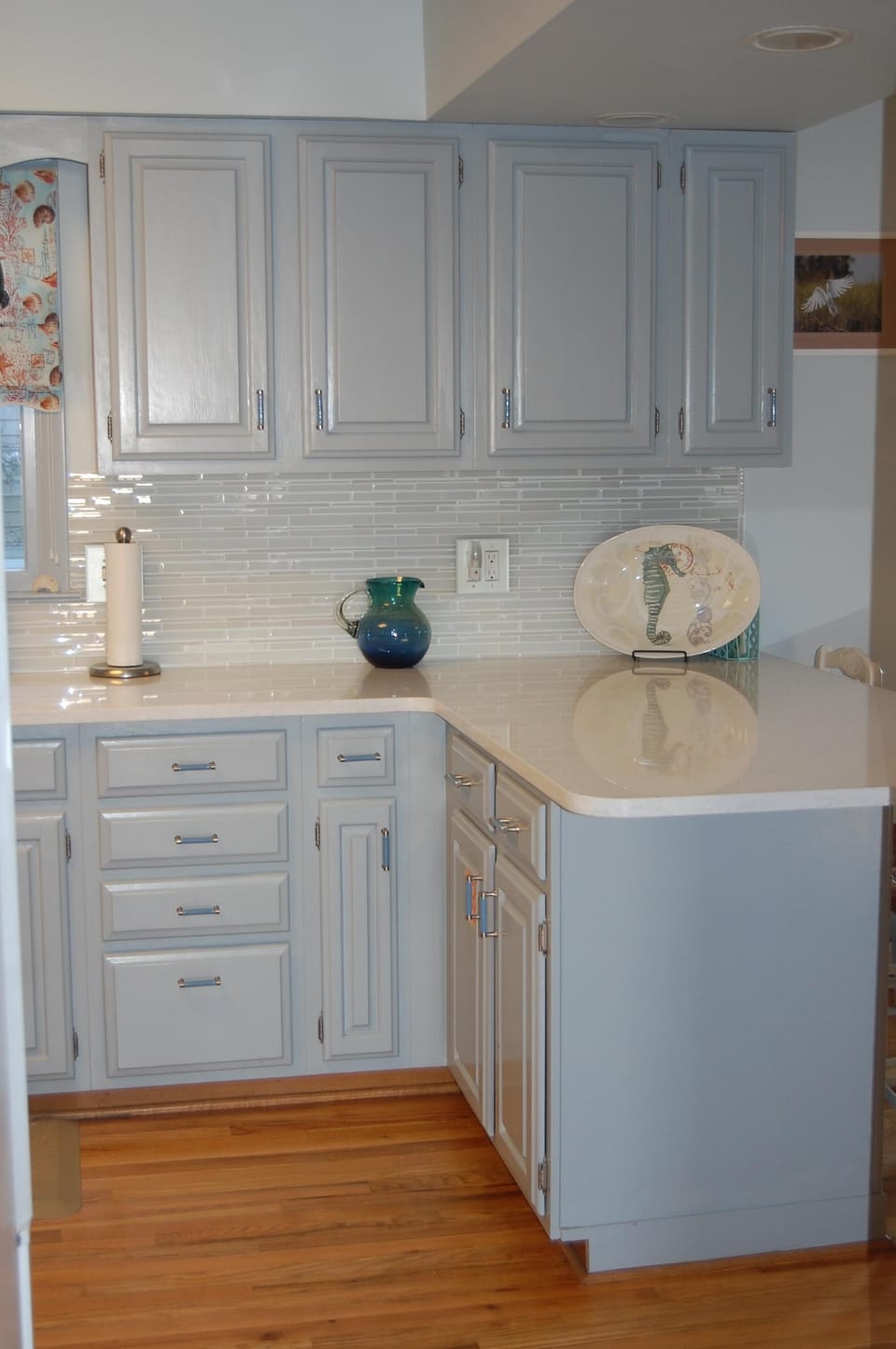 Upgraded kitchen with quartz counters, glass tile backsplash,  upgraded cabinets